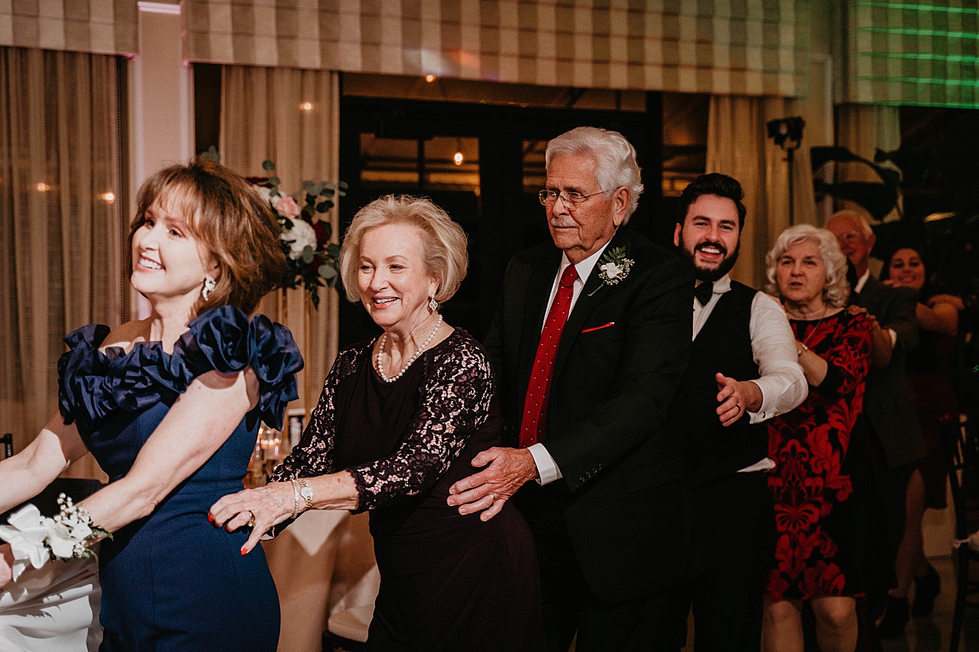 Conga line Reception Breakers West Wedding Photography captured by South Florida Wedding Photographer Krystal Capone Photography 