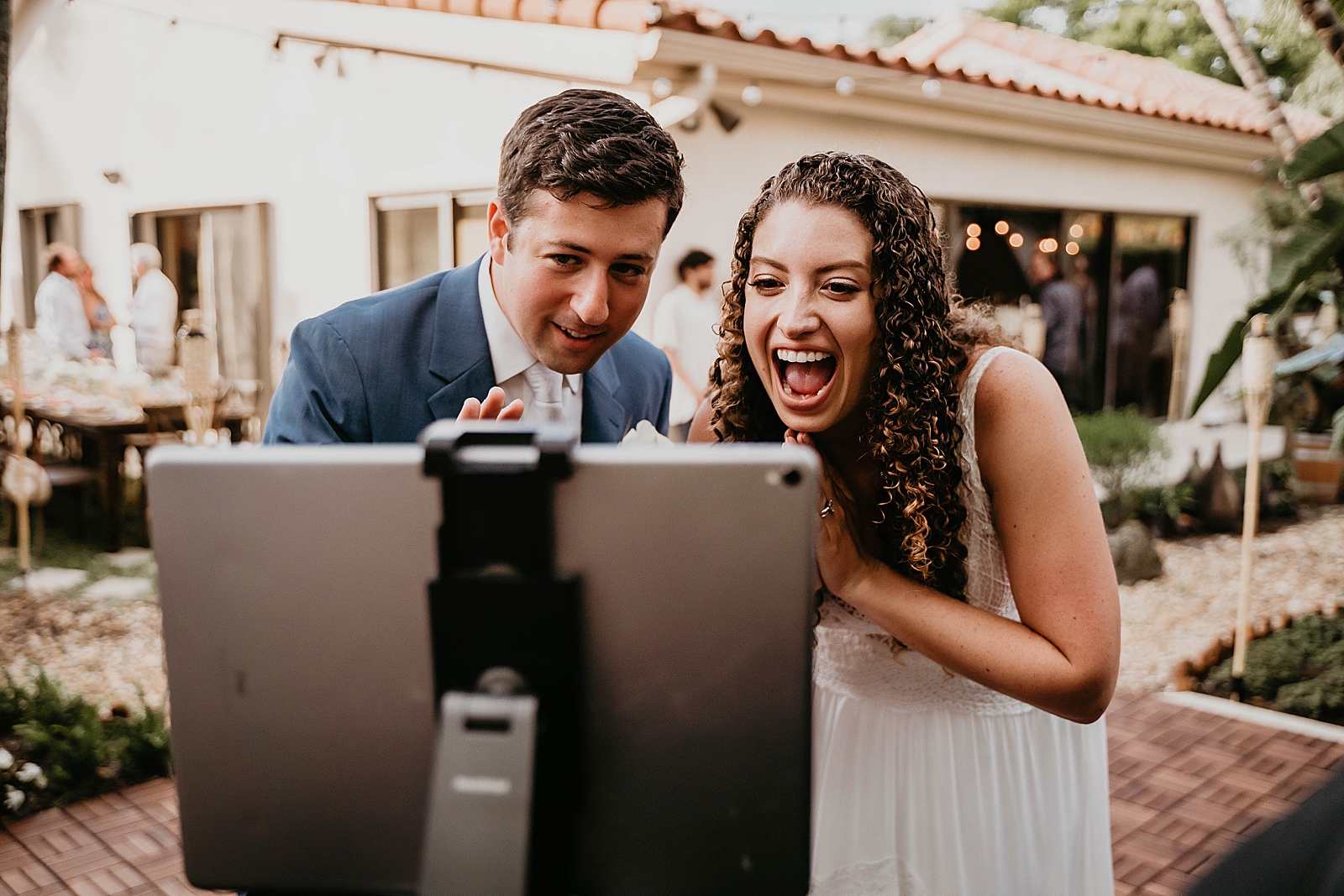 Bride and Groom saying hi to family who could not make it to the wedding on Zoom Intimate South Florida Wedding Photography captured by South Florida Wedding Photographer Krystal Capone Photography 