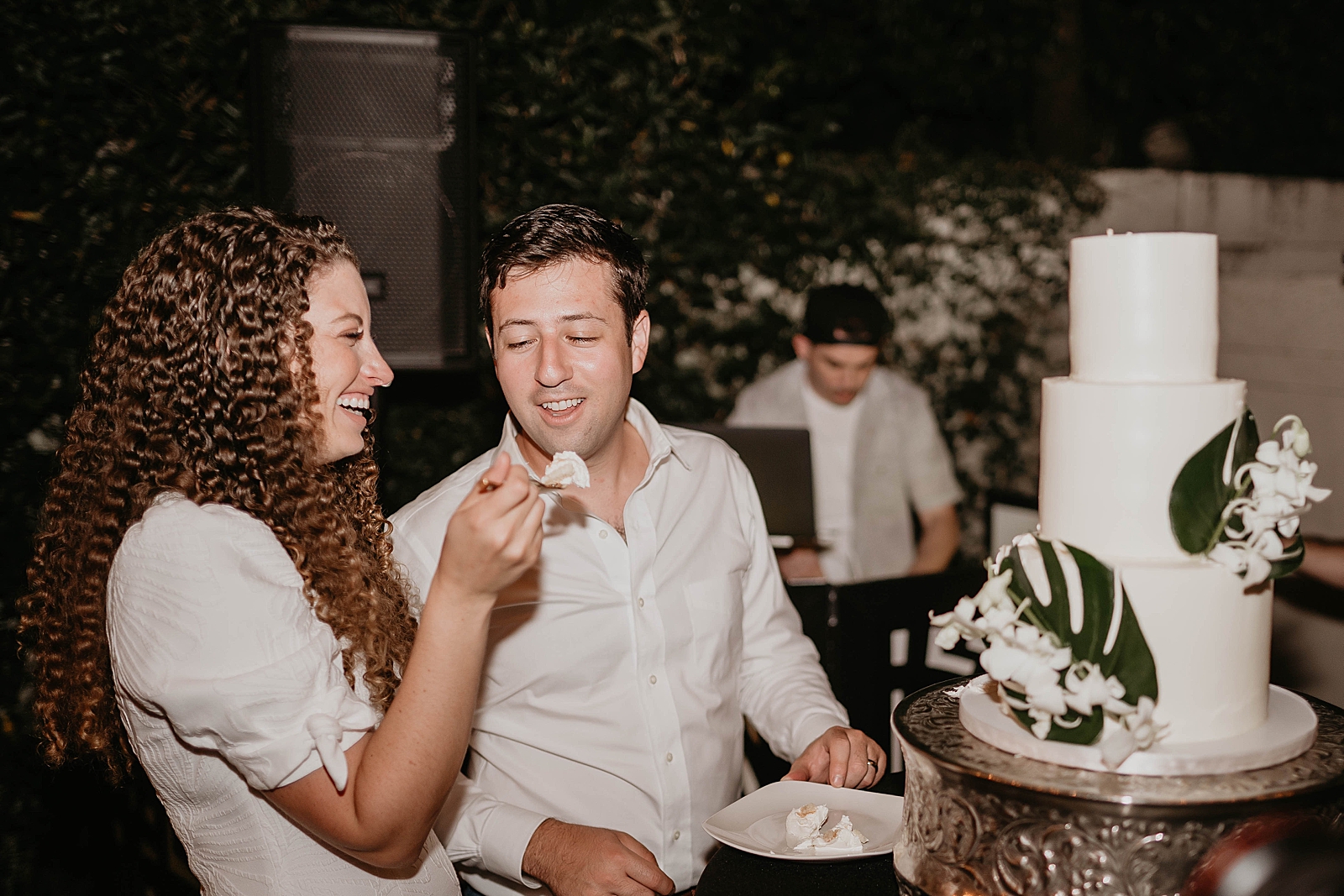Bride giving Groom a bite of wedding cake Intimate South Florida Wedding Photography captured by South Florida Wedding Photographer Krystal Capone Photography 