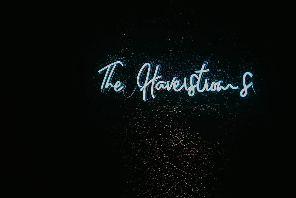 Neon last name sign Jupiter Beach Resort Wedding Photography captured by South Florida Wedding Photographer Krystal Capone Photography 
