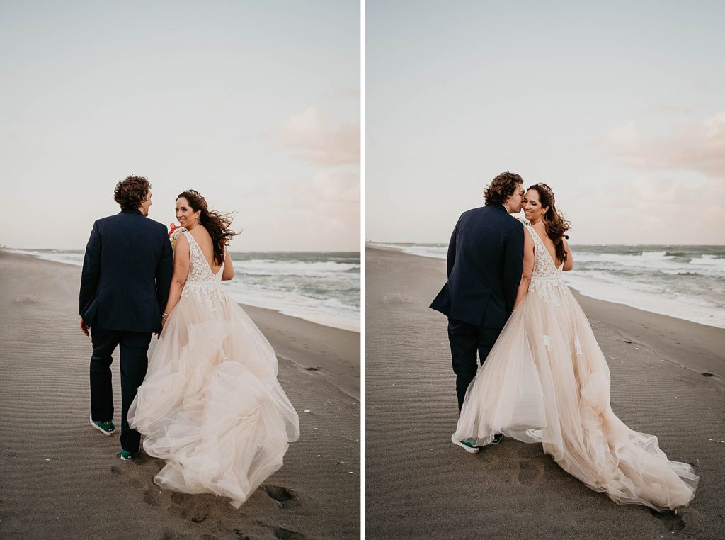 Bride looking back as she walks with Groom on the beach Jupiter Beach Resort Wedding Photography captured by South Florida Wedding Photographer Krystal Capone Photography 