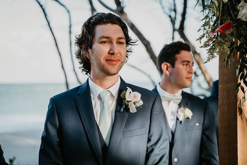 Groom awaiting Bride at the Ceremony Jupiter Beach Resort Wedding Photography captured by South Florida Wedding Photographer Krystal Capone Photography 