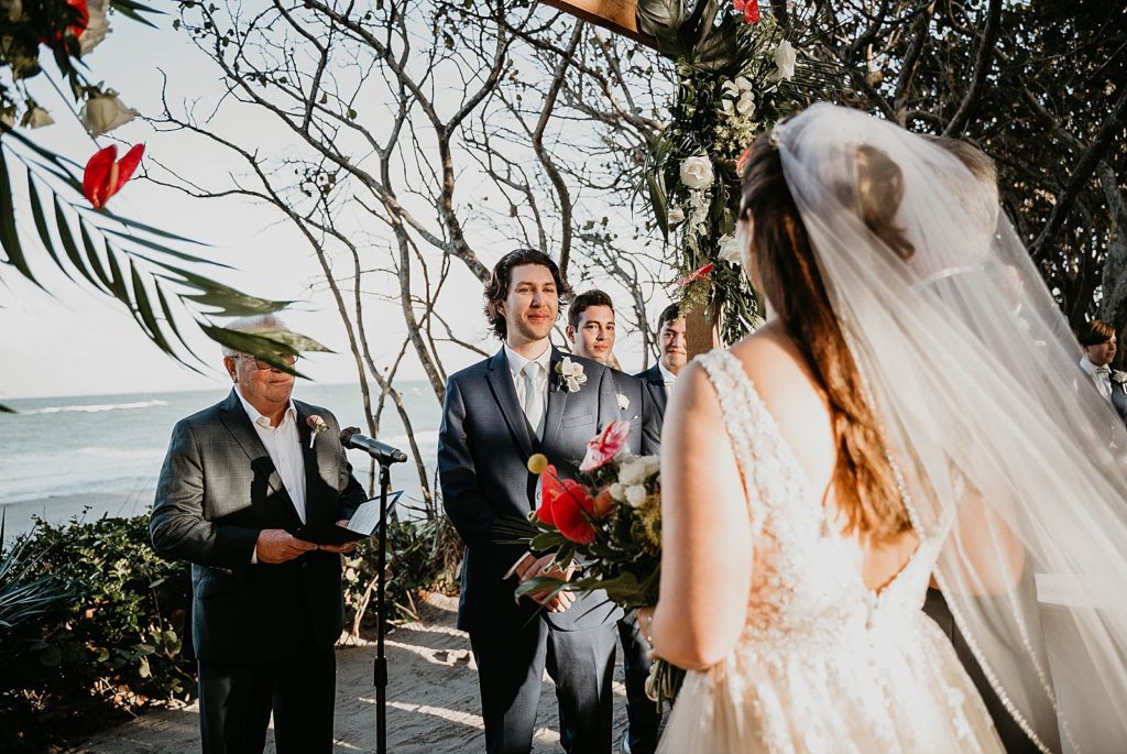 Groom's reaction to Bride going to the alter Ceremony Jupiter Beach Resort Wedding Photography captured by South Florida Wedding Photographer Krystal Capone Photography 