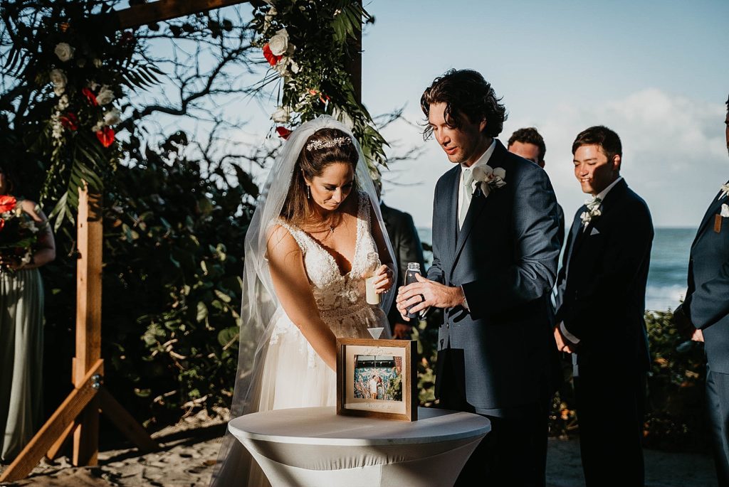 Bride and Groom doing drink pour unity ceremony Jupiter Beach Resort Wedding Photography captured by South Florida Wedding Photographer Krystal Capone Photography 