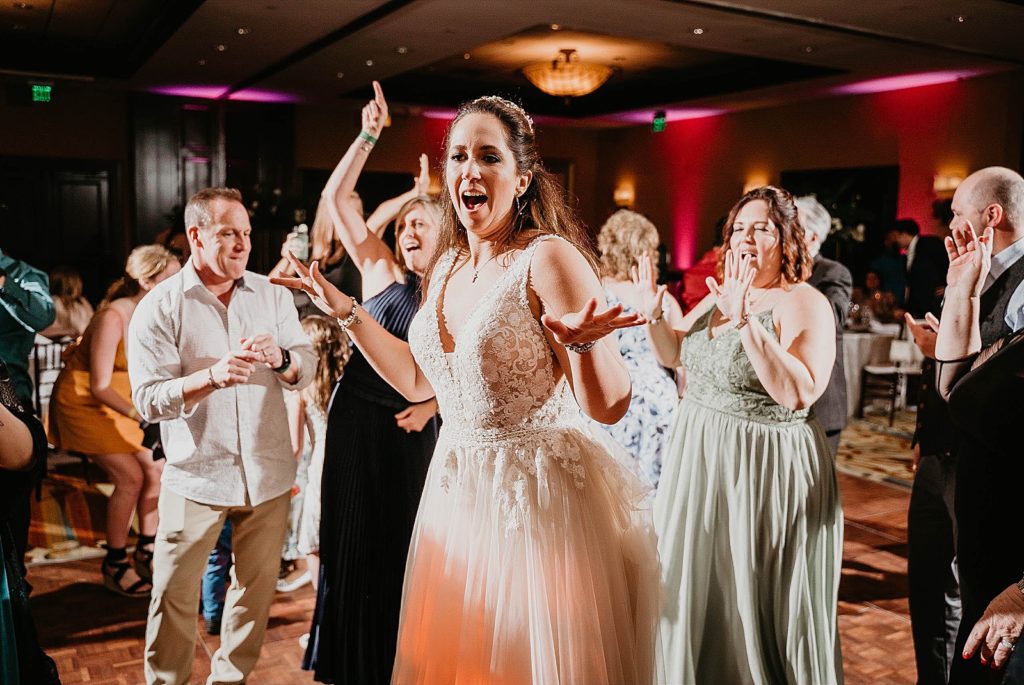 Bride dancing at Reception Jupiter Beach Resort Wedding Photography captured by South Florida Wedding Photographer Krystal Capone Photography 