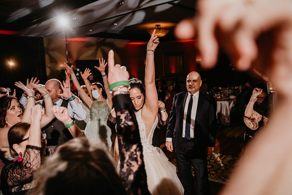 Bride having fun at Reception dancing Jupiter Beach Resort Wedding Photography captured by South Florida Wedding Photographer Krystal Capone Photography 