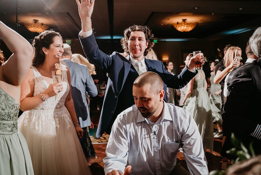 Bride and Groom having fun dancing with guests Reception Jupiter Beach Resort Wedding Photography captured by South Florida Wedding Photographer Krystal Capone Photography 