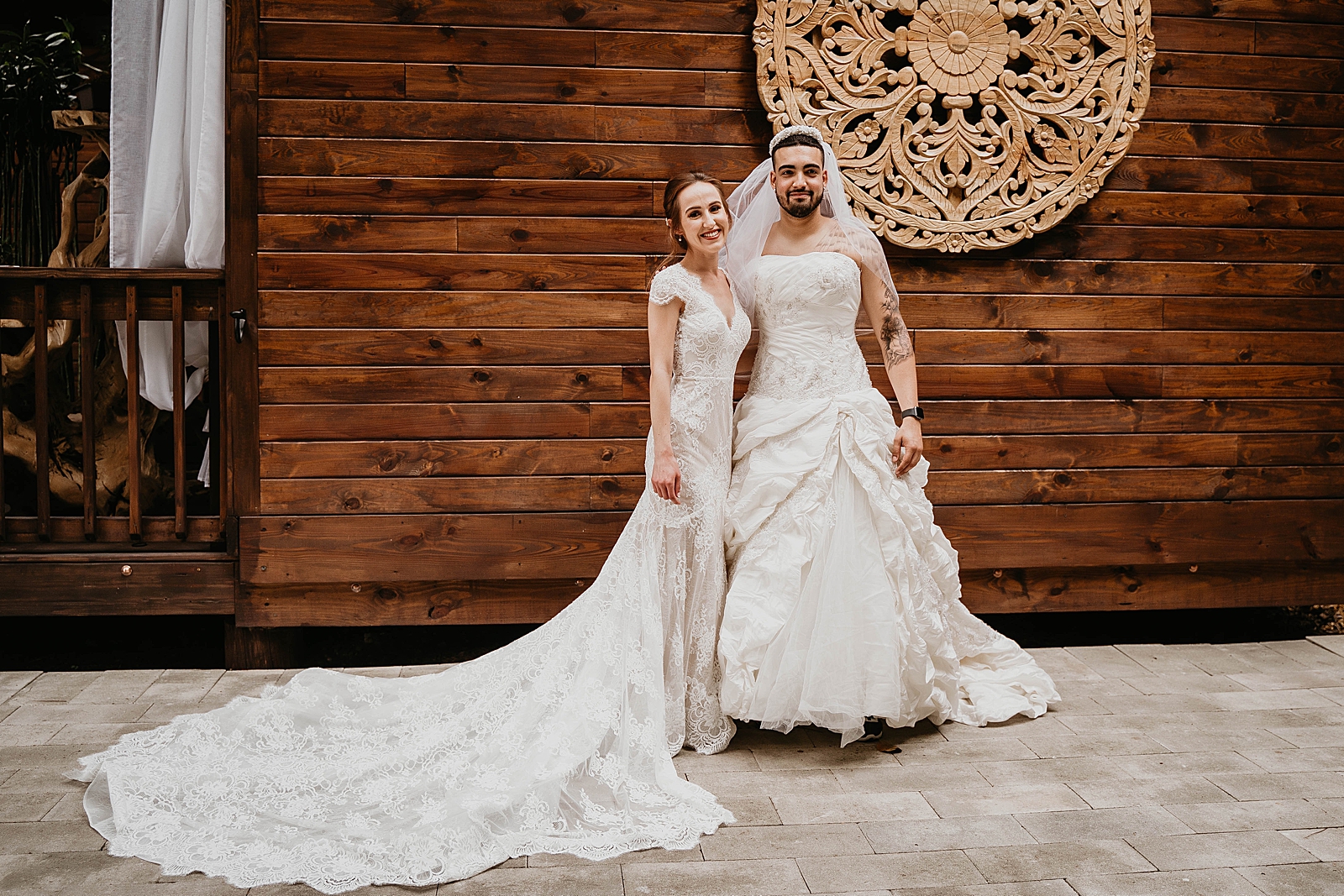 Bride posing with funny stunt double man in wedding dress practical prank Living Sculptures Sanctuary Wedding Photography captured by South Florida Wedding Photographer Krystal Capone Photography 