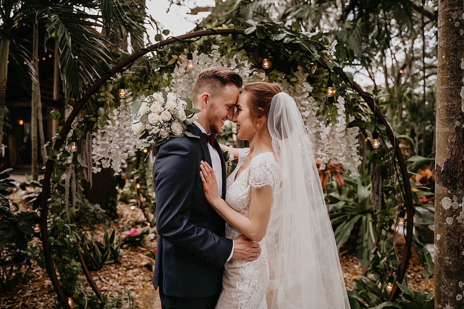 Bride and Groom nuzzling their noses in the garden area Living Sculptures Sanctuary Wedding Photography captured by South Florida Wedding Photographer Krystal Capone Photography  
