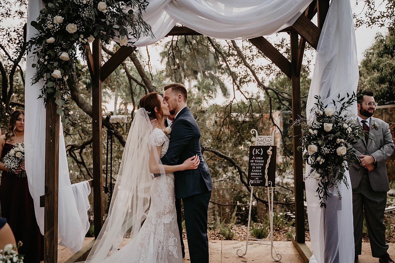 Just married Bride and Groom kissing Ceremony Living Sculptures Sanctuary Wedding Photography captured by South Florida Wedding Photographer Krystal Capone Photography 