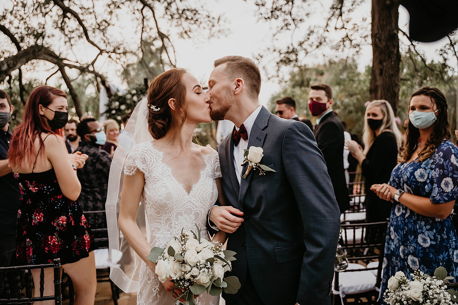 Bride and Groom kissing during Ceremony exit arm in arm Living Sculptures Sanctuary Wedding Photography captured by South Florida Wedding Photographer Krystal Capone Photography 