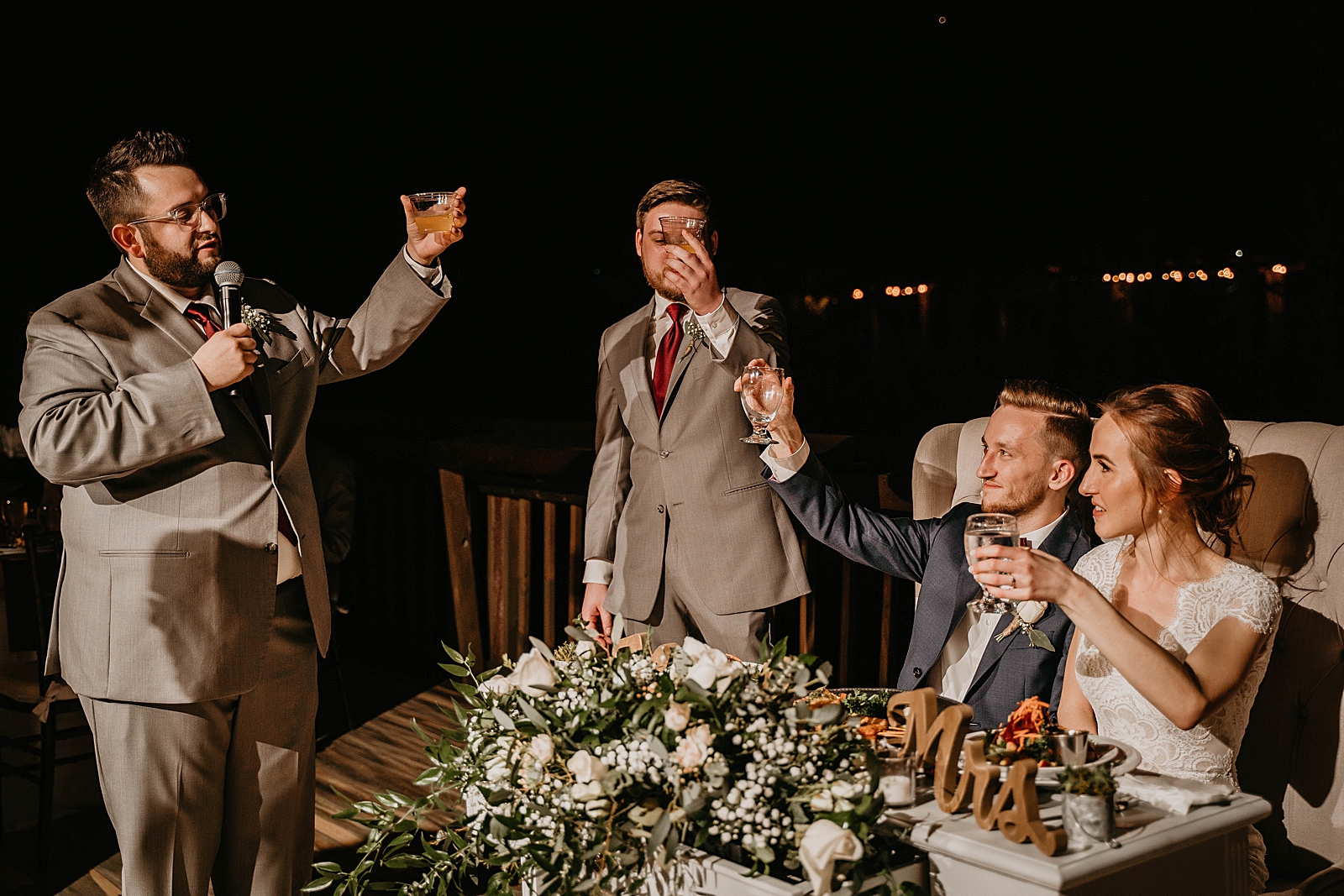 Groomsmen toast at Reception by Bride and Groom at sweetheart table Living Sculptures Sanctuary Wedding Photography captured by South Florida Wedding Photographer Krystal Capone Photography 