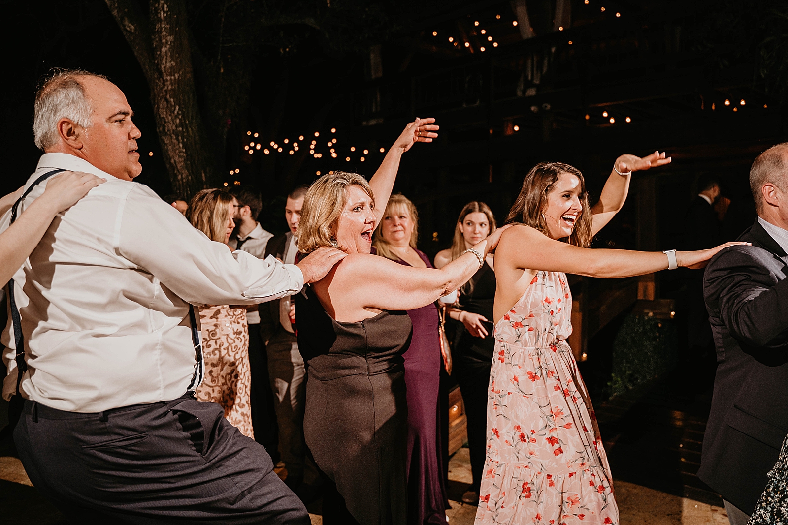 Conga dance line Living Sculptures Sanctuary Wedding Photography captured by South Florida Wedding Photographer Krystal Capone Photography 