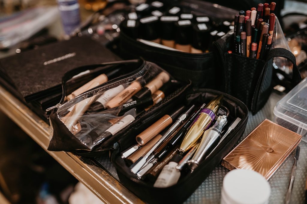 Detail shot of all the makeup pens and brushes Pelican Club Wedding Photography captured by South Florida Wedding Photographer Krystal Capone Photography 