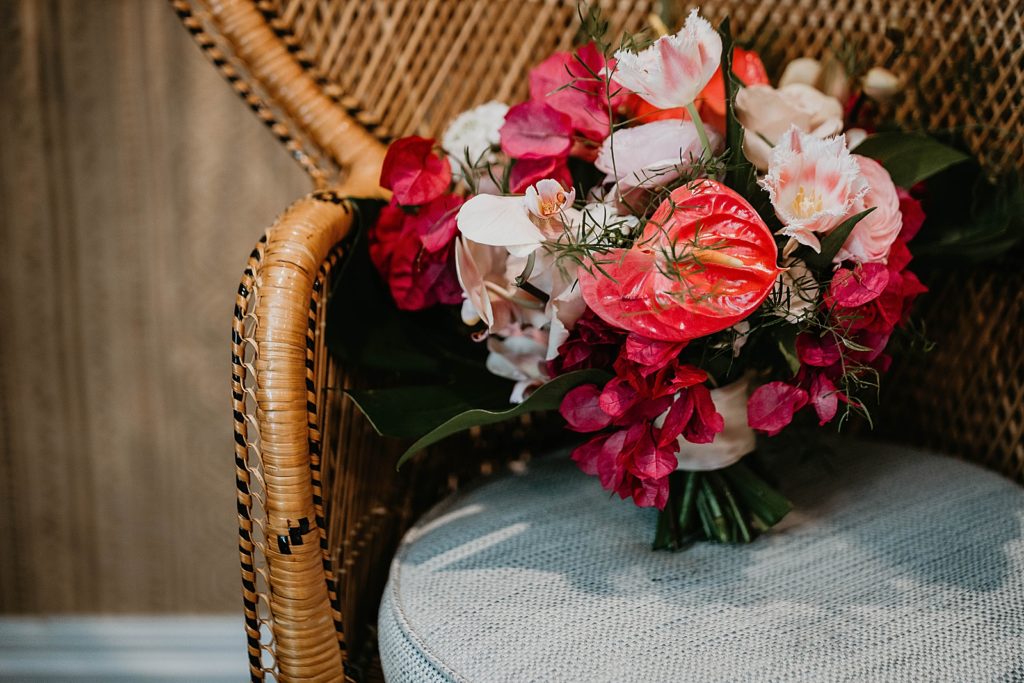 Detail shot of red and bright bridal bouquet Pelican Club Wedding Photography captured by South Florida Wedding Photographer Krystal Capone Photography 