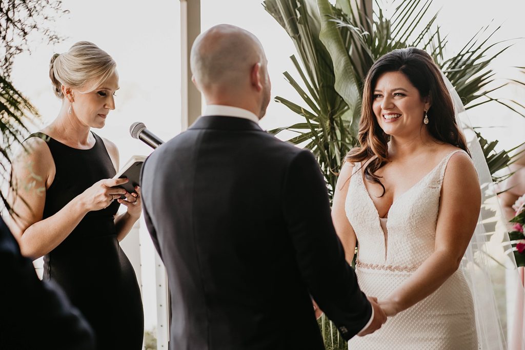 Bride looking at Groom during ceremony Pelican Club Wedding Photography captured by South Florida Wedding Photographer Krystal Capone Photography 