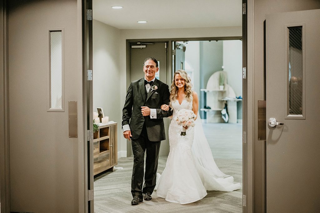Father and Bride entering Ceremony Pelican Club Wedding Photography captured by South Florida Wedding Photographer Krystal Capone Photography