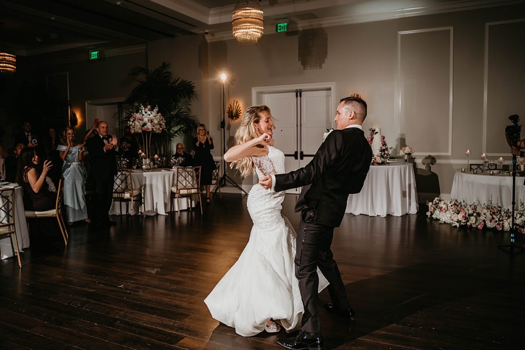 Bride and Groom having fun dancing first dance Pelican Club Wedding Photography captured by South Florida Wedding Photographer Krystal Capone Photography