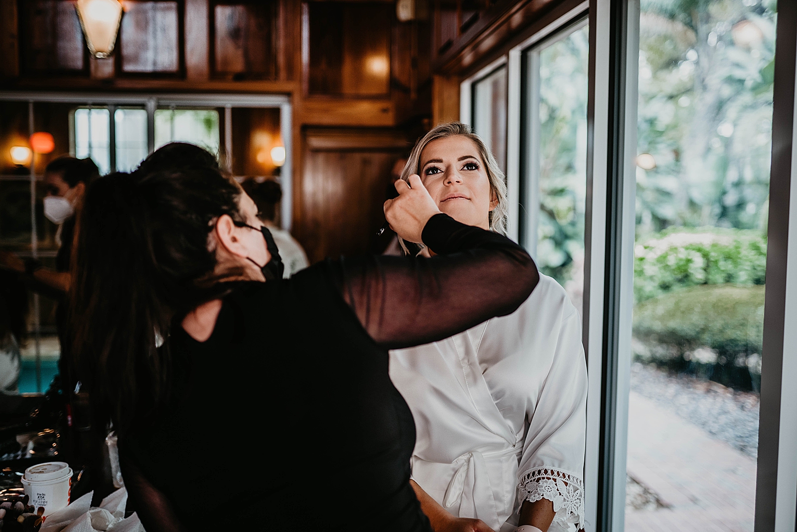 Bride Getting ready having makeup artist do makeup