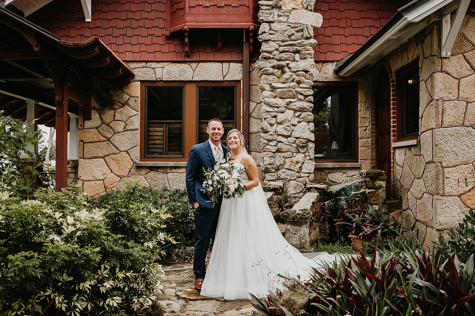Bride and Groom portrait outside of stone house