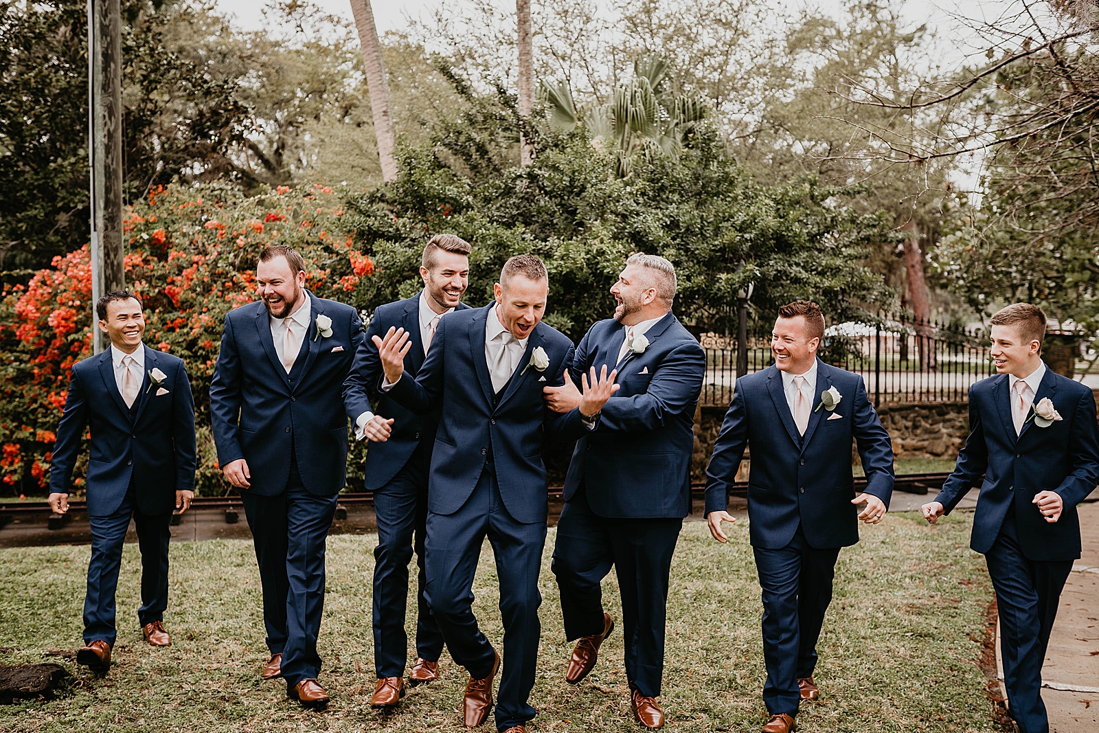 Casual and fun picture of Groomsmen and Groom walking together