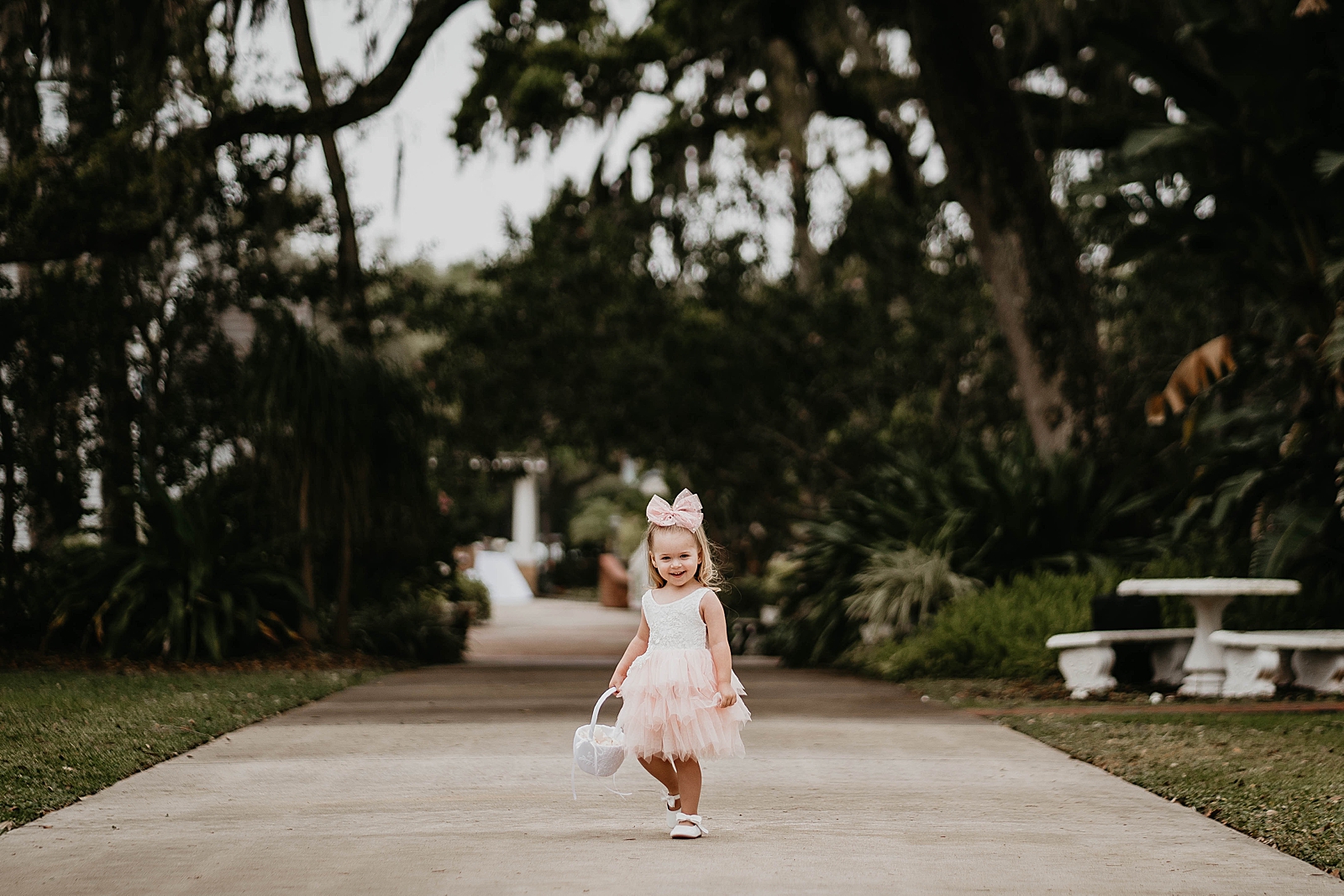 Flower girl walking on the sidewalk