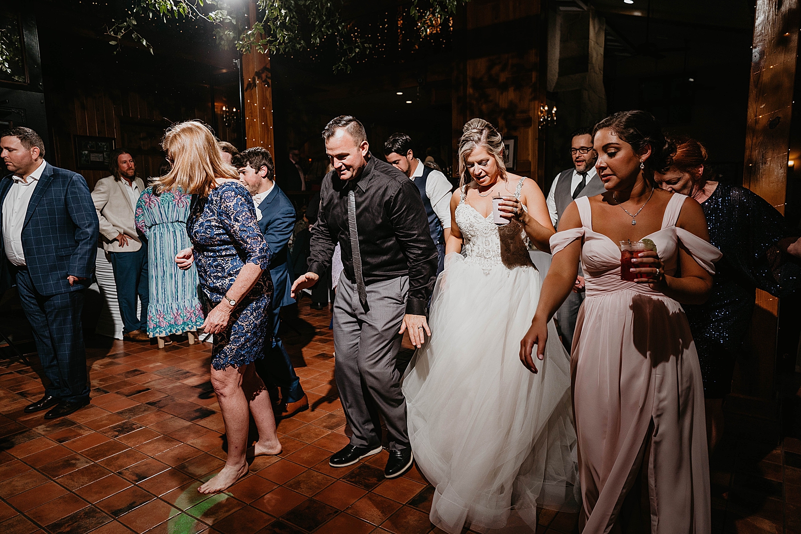 Bride dancing with guests