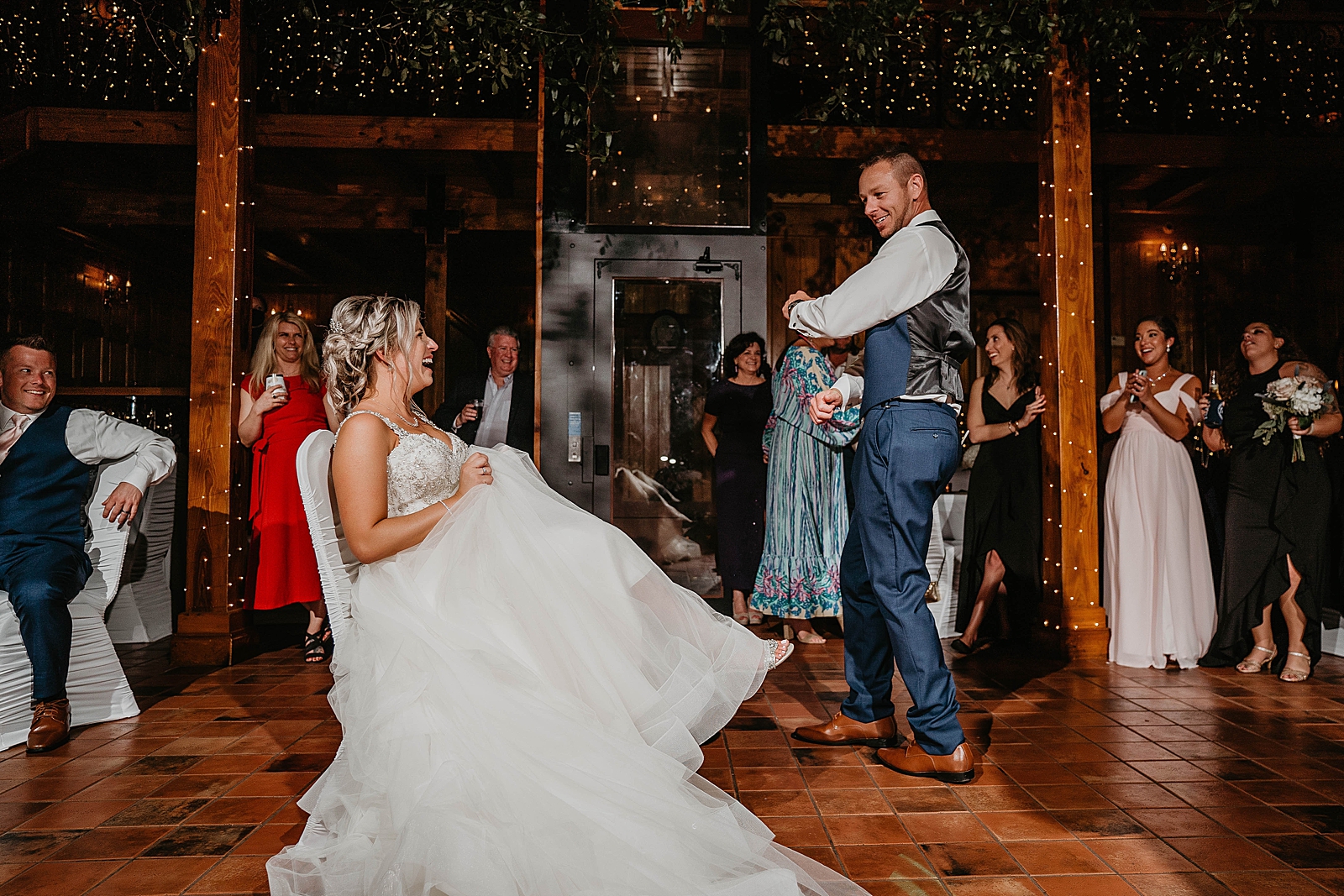 Groom dancing to get the garter