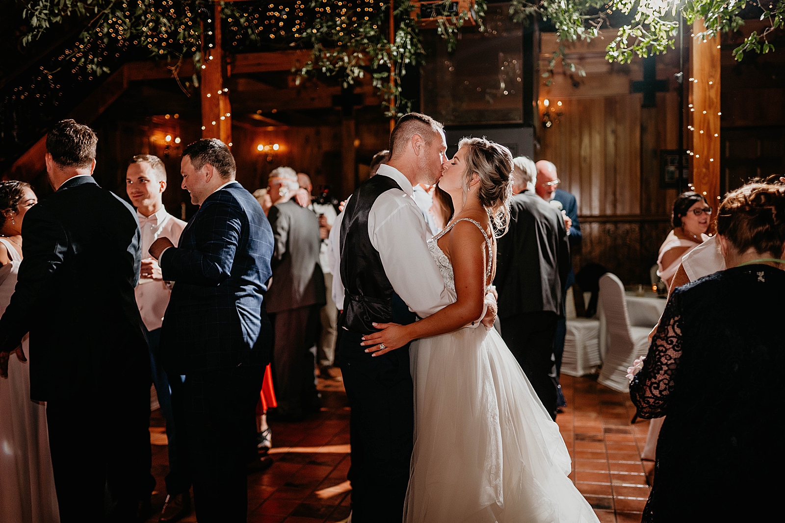 Bride and Groom kissing during slow dance