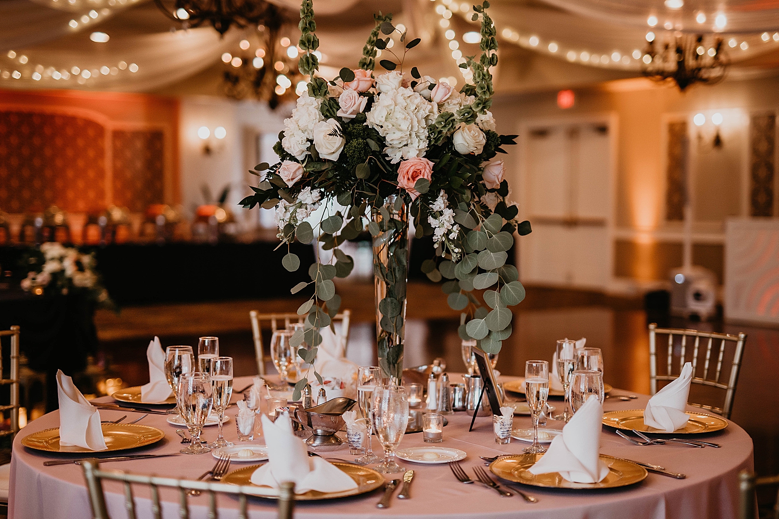 Detail shot of Reception table with flower centerpiece