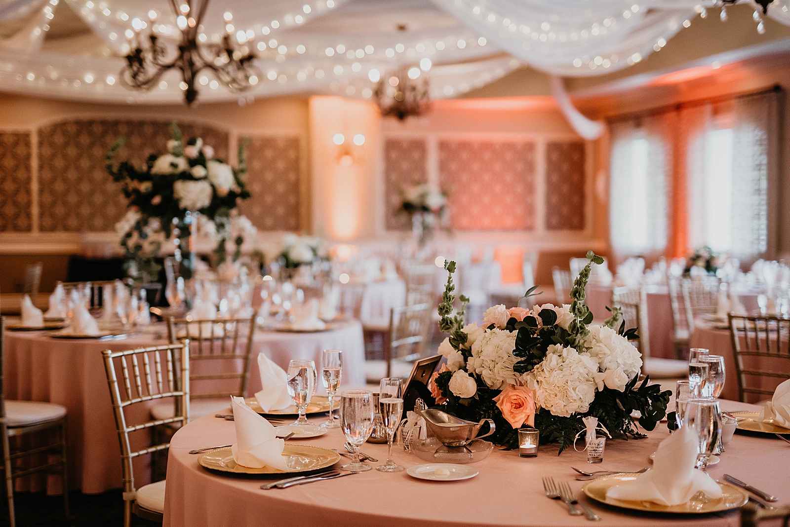 Detail shot of Reception tables with flower centerpieces