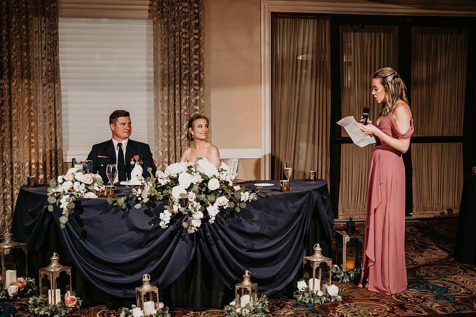 Bride and Groom listening to Maid of Honor Speech at sweetheart table